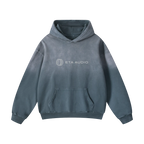 Sunfaded ETA Audio hoodie in blue-grey gradient, front view with chest logo on black background