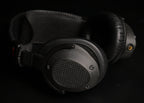 ETA Mini Closed pair of cups with diamond mesh grills and suspension headband, side view