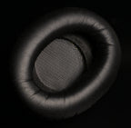 ETA Mini Closed earpad close up showing leatherette outer ring and metal mesh driver protector