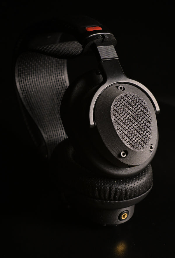 2022 — ETA Mini Semi-Closed — ETA Mini Semi-Closed over-ear headphone pair view with diamond mesh grills and suspension headband