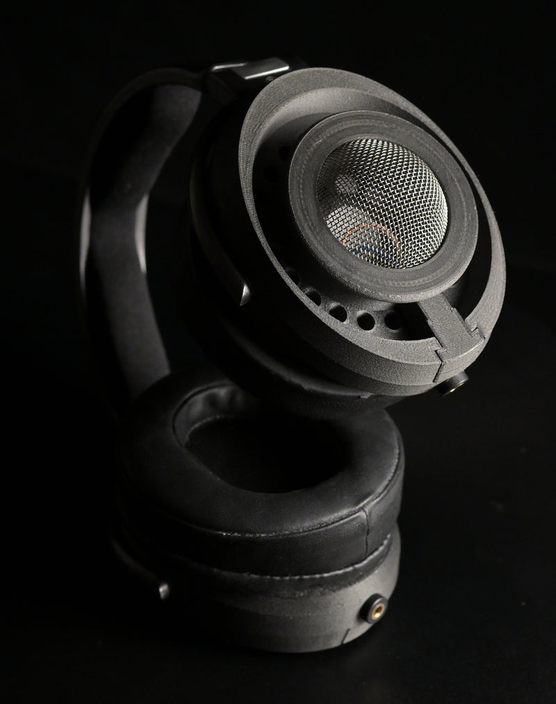 ETA Genesis OG headphone close-up of vented driver chassis with central mesh and ring of vent holes