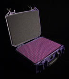 Open ETA ULI purple hard case showing foam padding and ETA-patterned interior tray