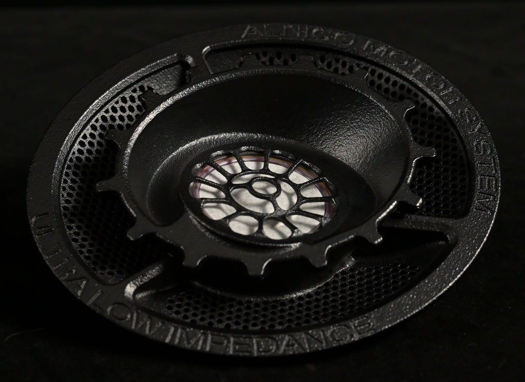 ETA ULI 8th-generation driver chassis engraved 'AlNiCo Motor System' and 'Ultra Low Impedance', showing the floral spoke baffle and magnet